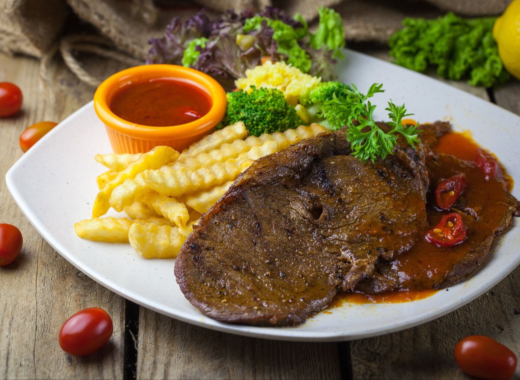 Steak with fries and sauce at Tree Steak House
